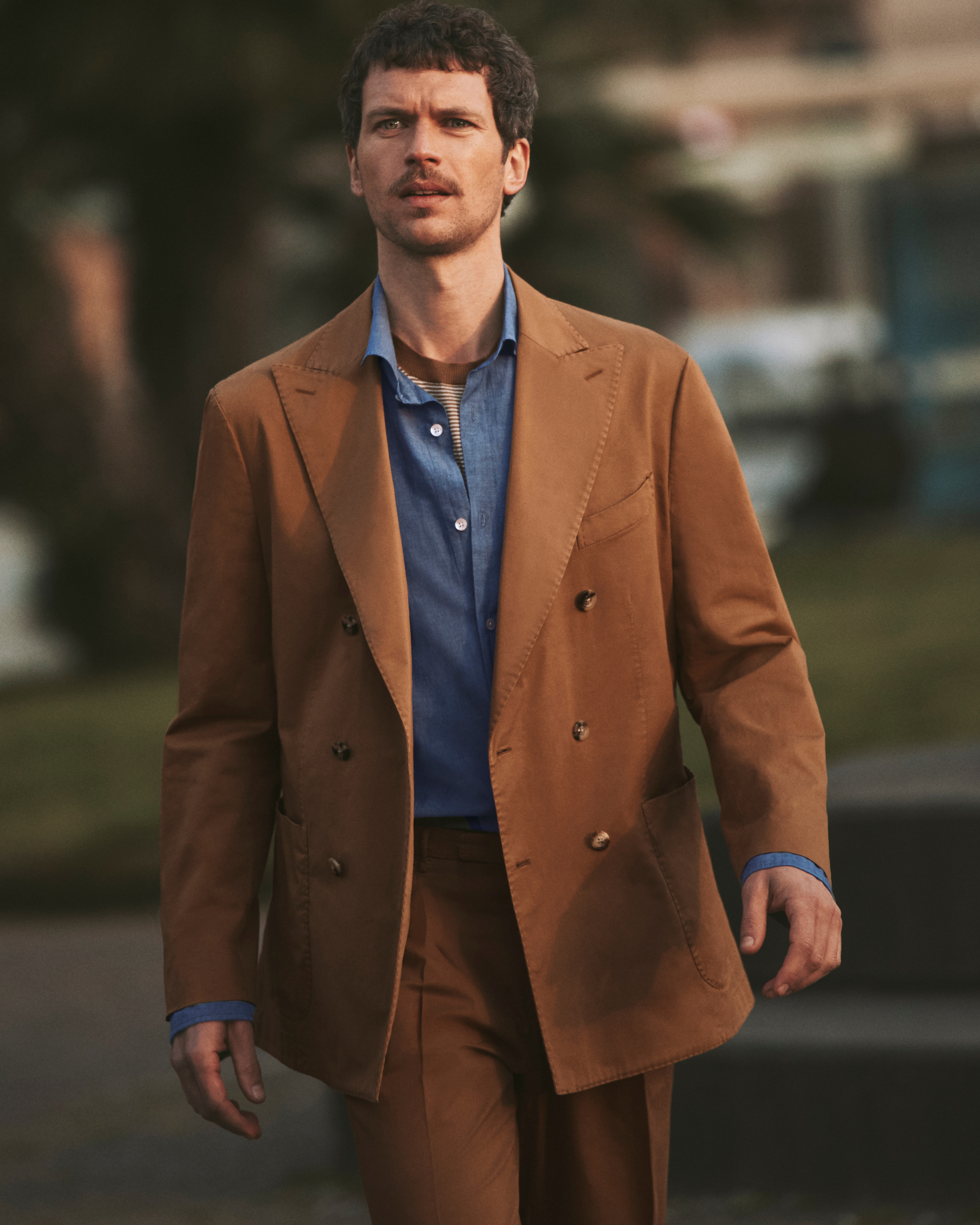 person in brown suit